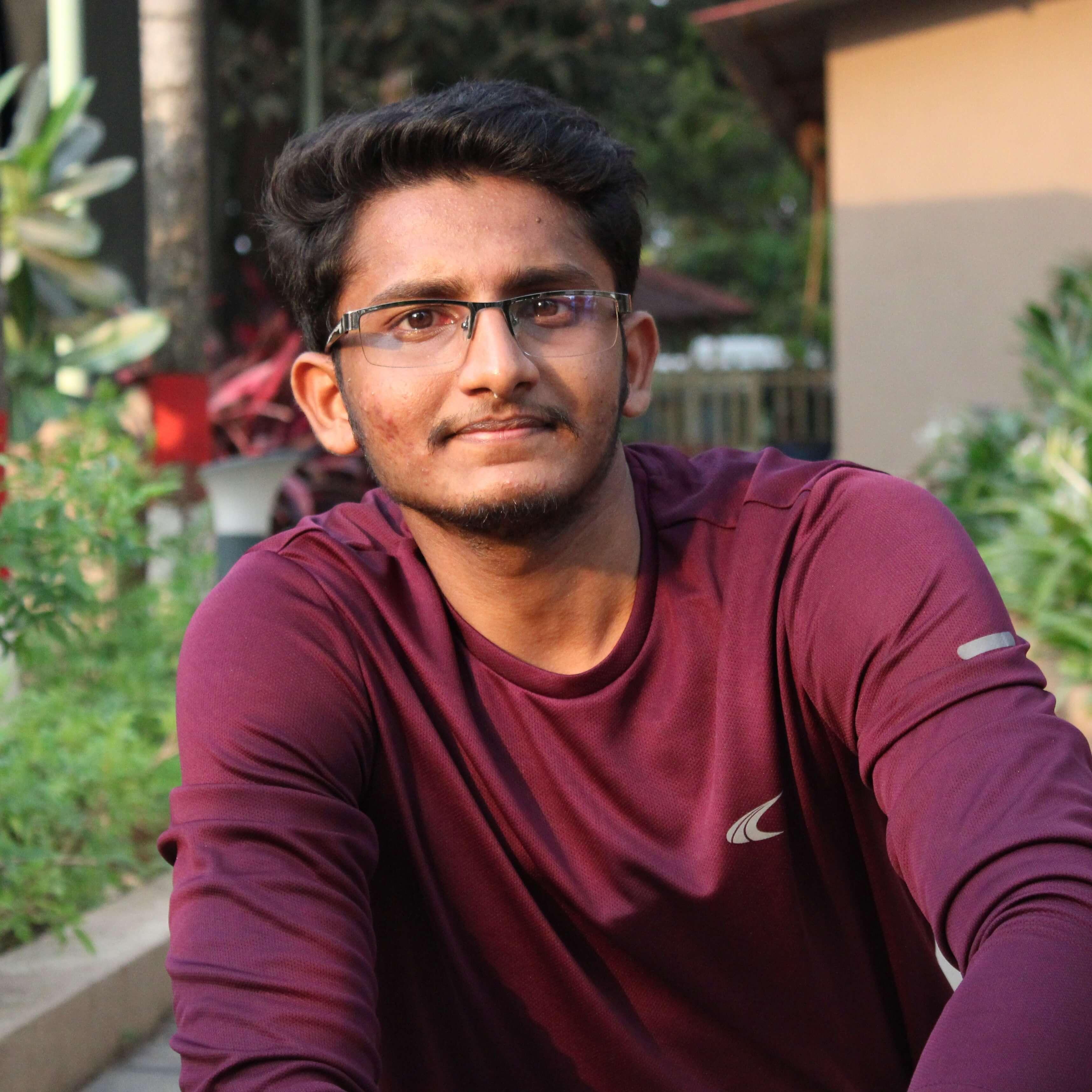 kamaleshpathy posing near a dam